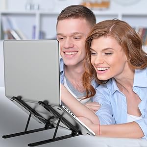 Adjustable laptop stand with multiple angle positions, demonstrated by two people using it with a laptop.